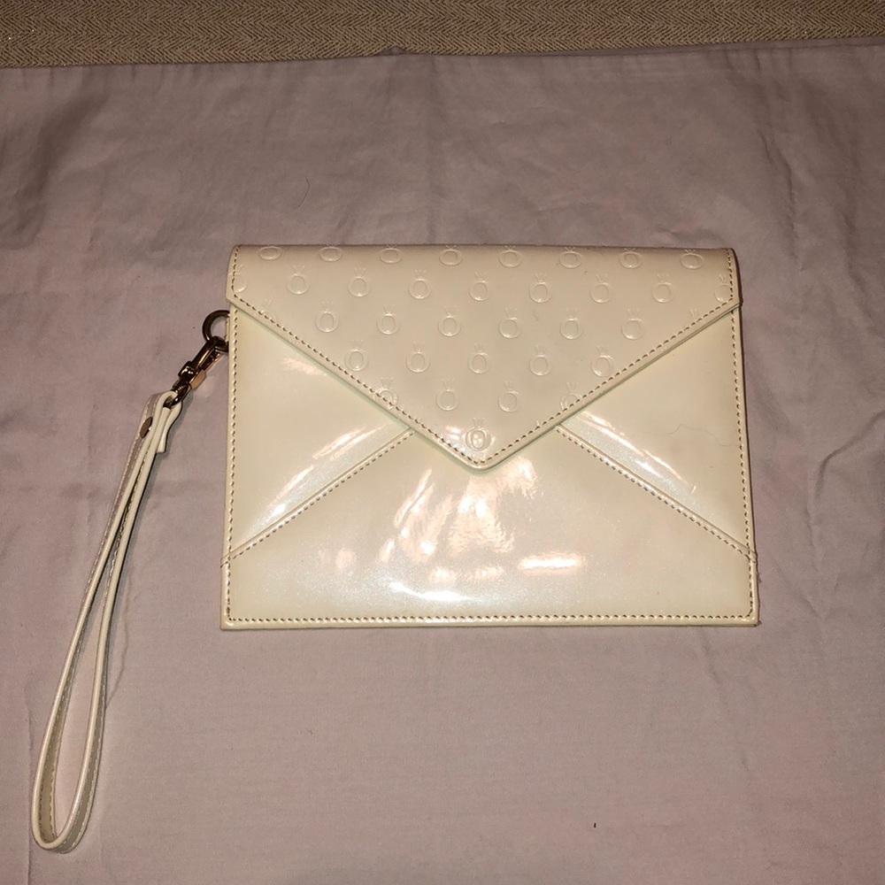 Ladies cream color wristlet purse Patton leather.